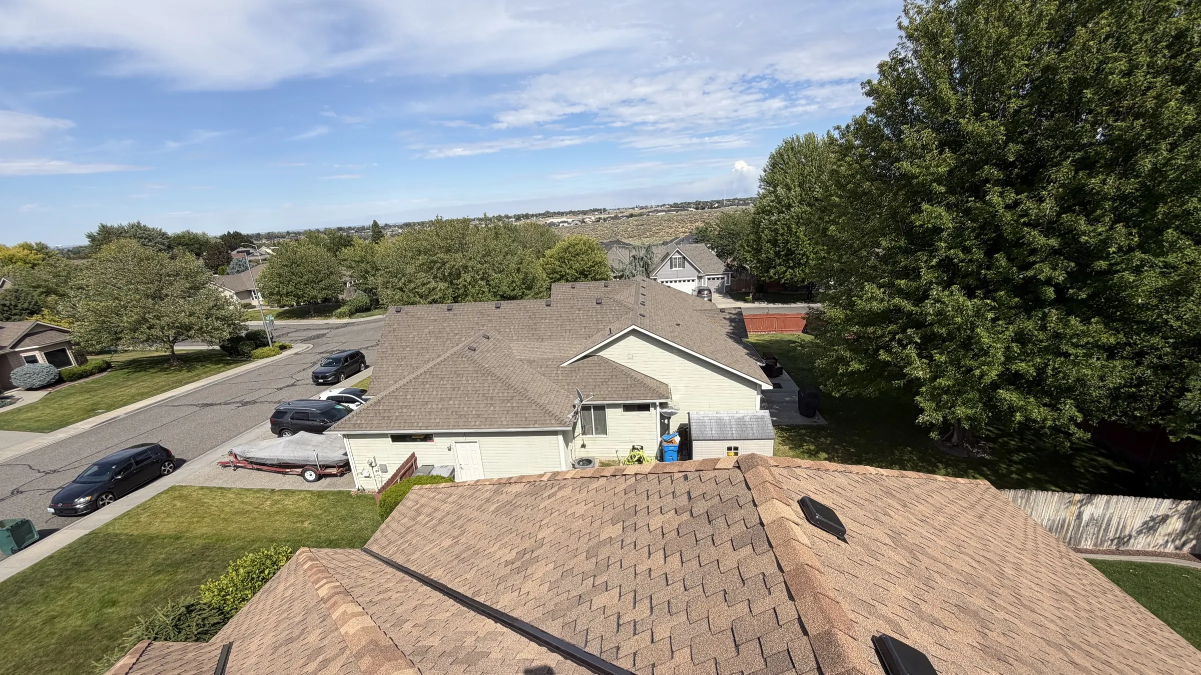 Completed roof replacement overlooking a Tri-Cities neighborhood in Eastern Washington