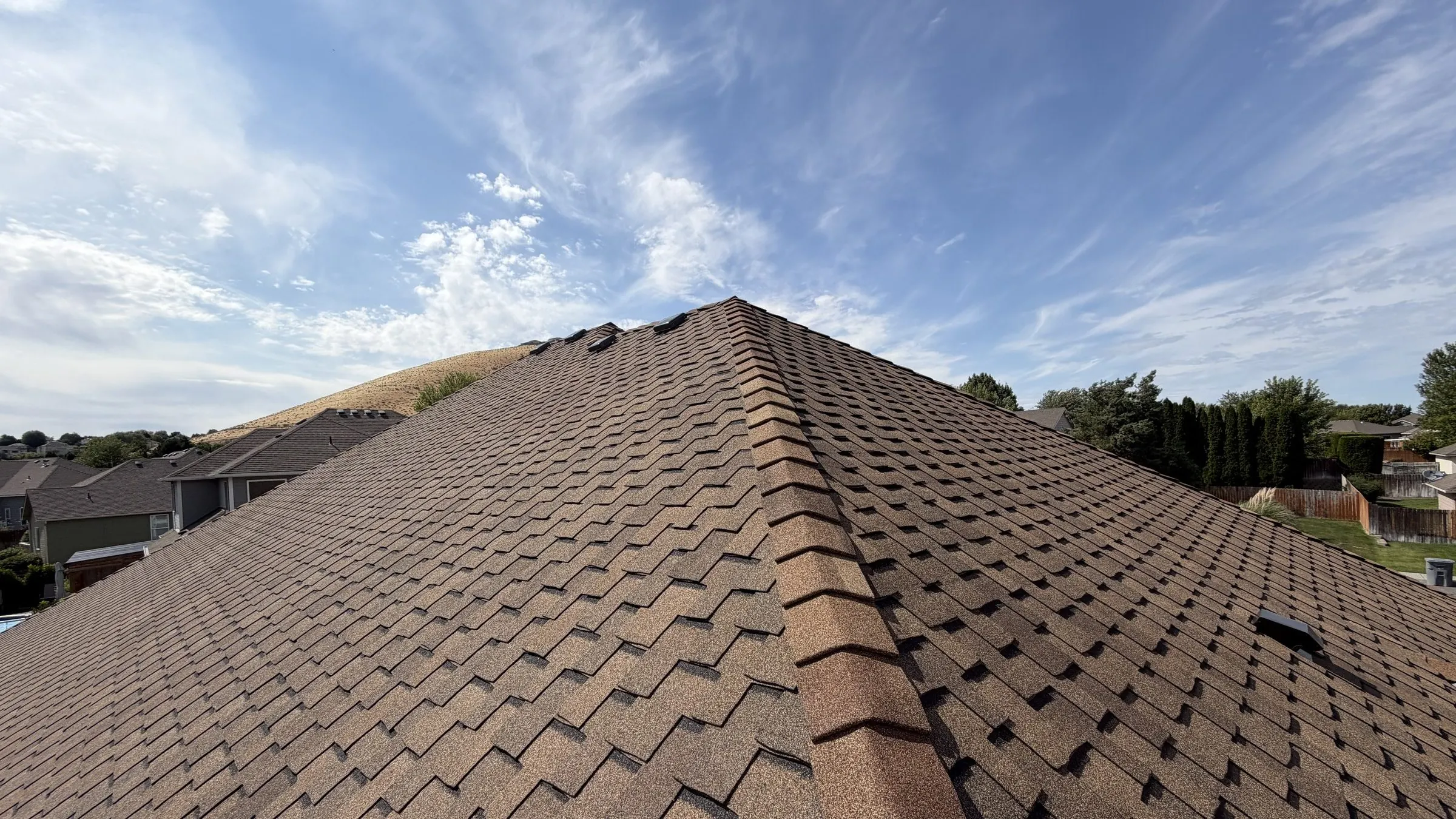 A completed architectural shingle roof replacement on a home in the Tri-Cities, Eastern Washington