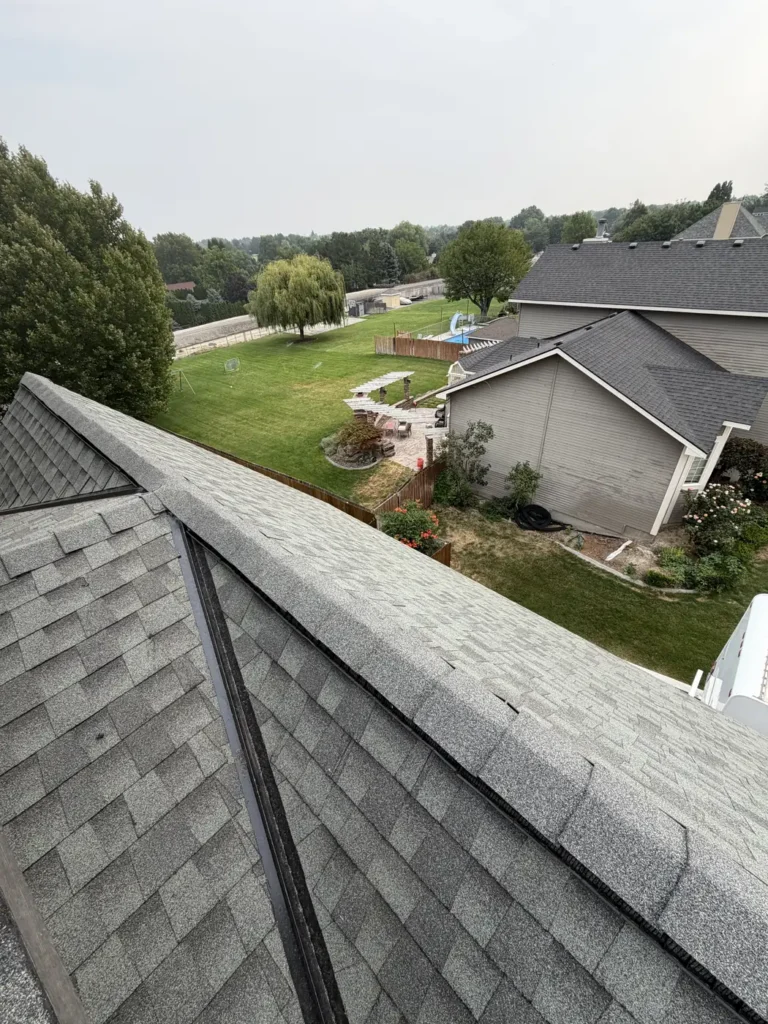 Completed ridge above a green lawn and a neighbouring home