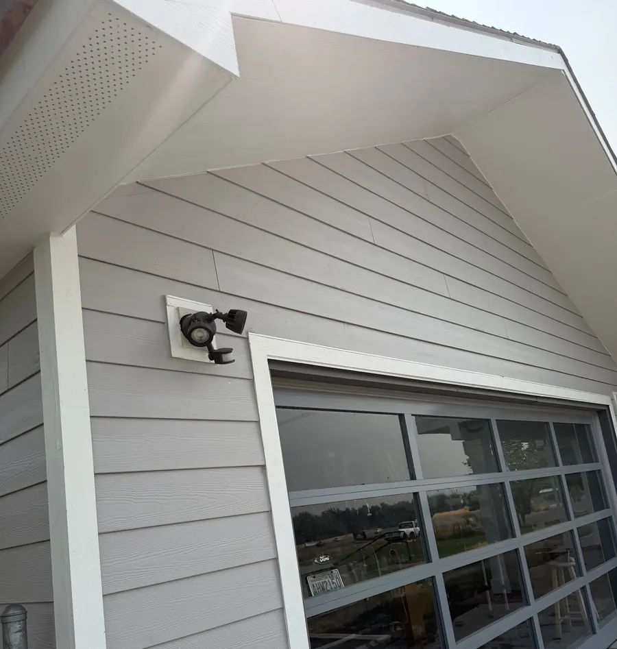 New siding, soffit and trim on a finished home exterior