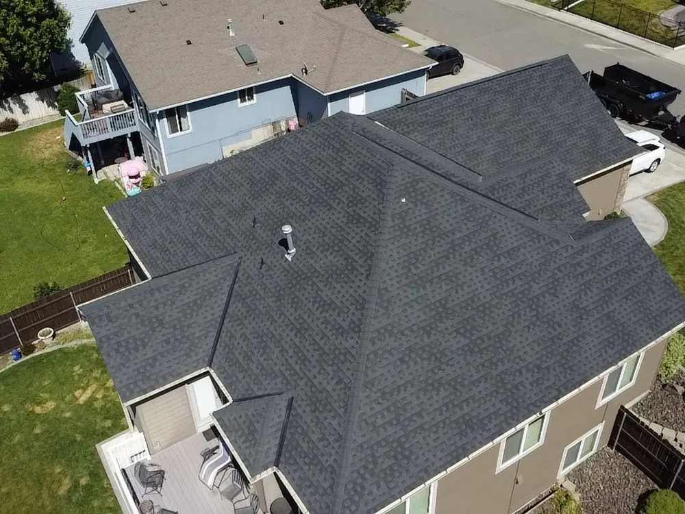 Aerial view of a finished architectural shingle roof replacement